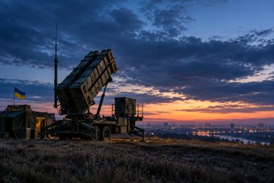 Editorial illustration of a Patriot air-defense system in Ukraine.
